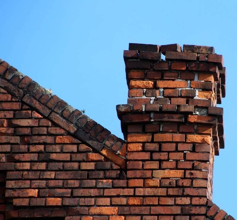 Signs Your Essex Home Needs a Chimney Inspection Damaged chimney on an Essex home showing cracks and missing mortar